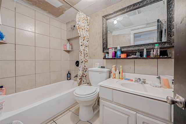 full bathroom featuring vanity, toilet, tile patterned flooring, and shower / bath combo with shower curtain