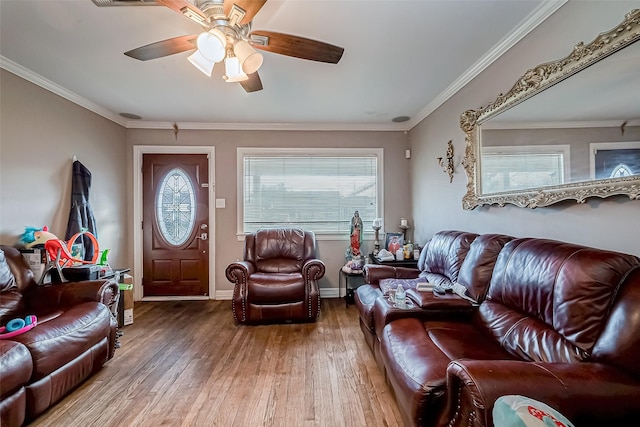 living room featuring ceiling fan, ornamental molding, and hardwood / wood-style floors