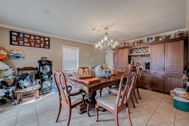 dining area with light tile patterned floors, a notable chandelier, and ornamental molding