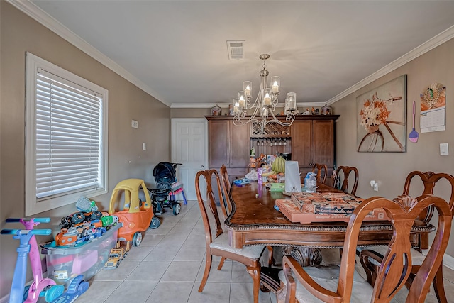 tiled dining area featuring ornamental molding and a chandelier