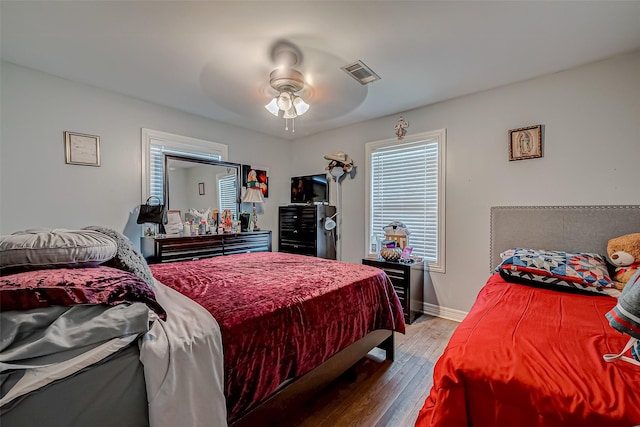 bedroom featuring hardwood / wood-style flooring and ceiling fan