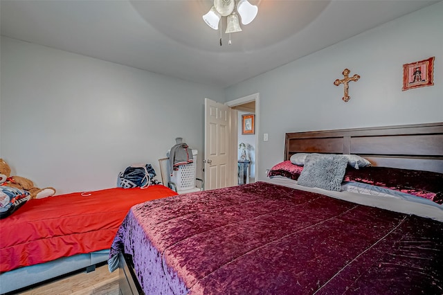 bedroom with wood-type flooring and ceiling fan