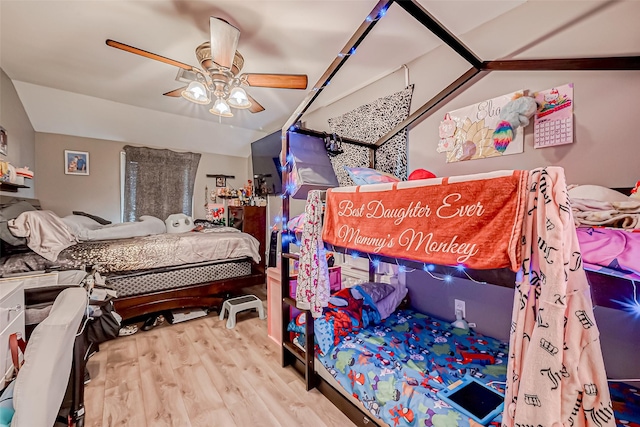 bedroom featuring lofted ceiling, ceiling fan, and light hardwood / wood-style flooring