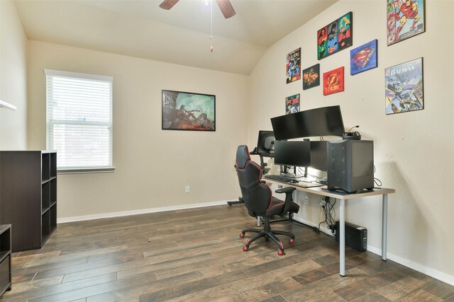 office space featuring ceiling fan, dark hardwood / wood-style floors, and vaulted ceiling