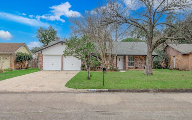 ranch-style home featuring a garage and a front yard