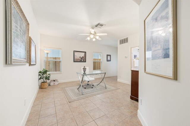 tiled home office with ceiling fan