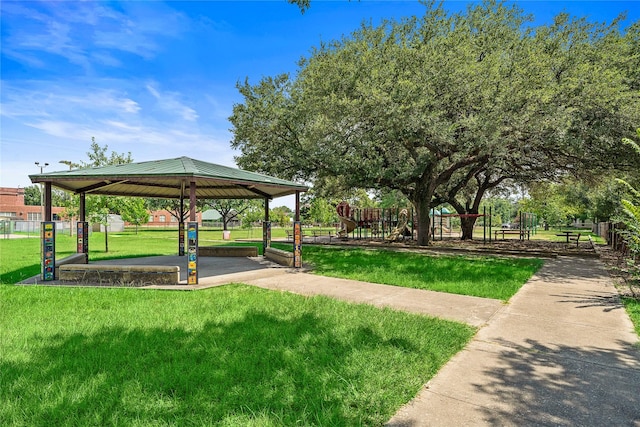 surrounding community with a gazebo, a lawn, and a playground