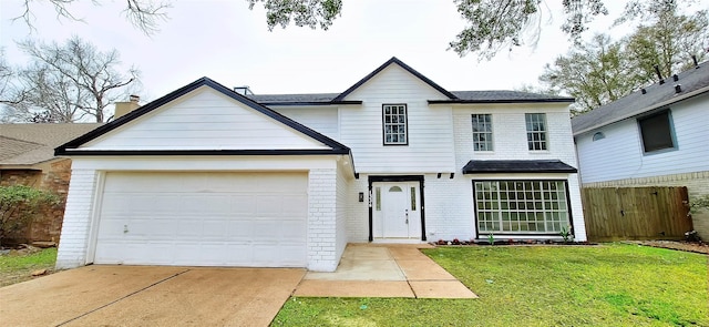 view of front facade featuring a garage and a front lawn