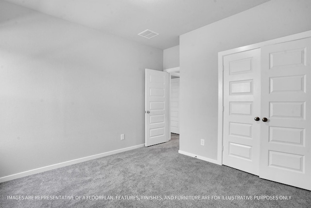 unfurnished bedroom with a closet, baseboards, visible vents, and carpet floors