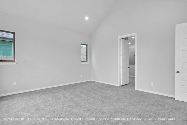 spare room with recessed lighting, high vaulted ceiling, baseboards, and carpet floors