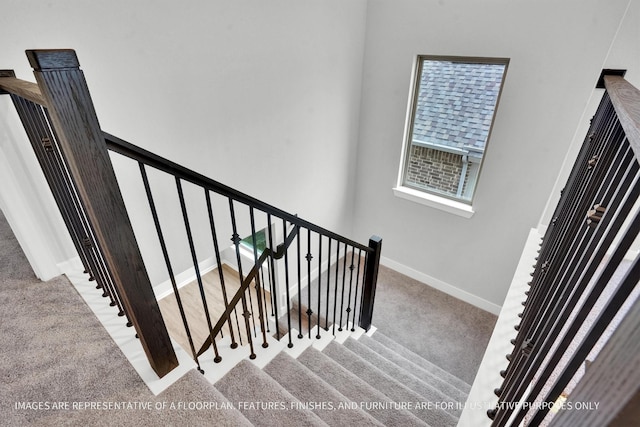 stairs with carpet flooring and baseboards