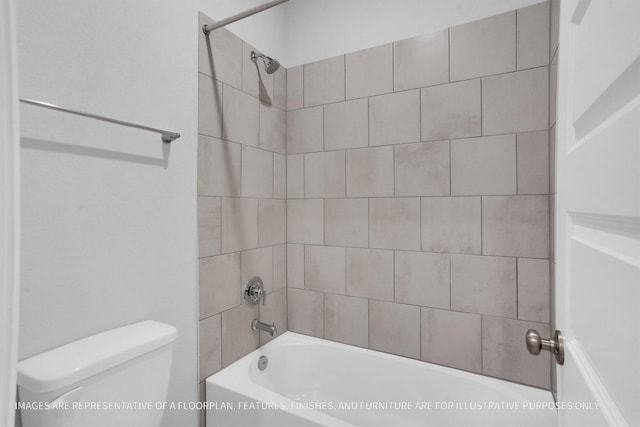 bathroom featuring toilet and washtub / shower combination