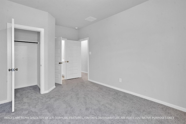 unfurnished bedroom with a closet, baseboards, carpet, and visible vents