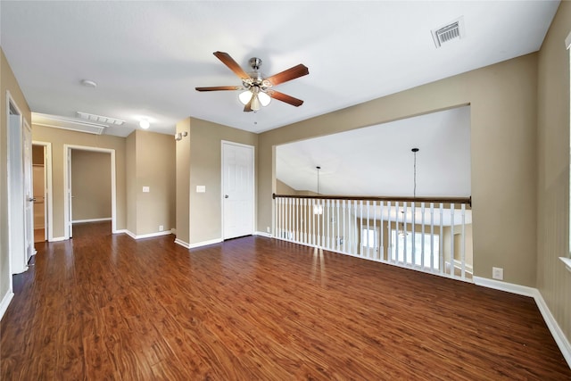 spare room with dark hardwood / wood-style floors and ceiling fan