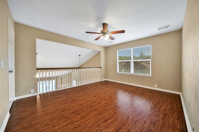 spare room featuring ceiling fan and dark hardwood / wood-style floors