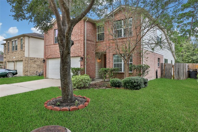 view of front of house with a garage and a front yard