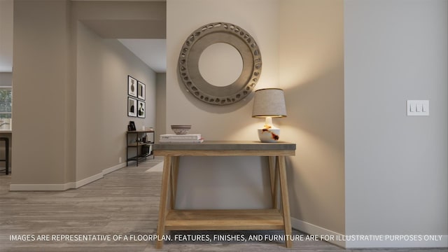 hall with baseboards and wood finished floors