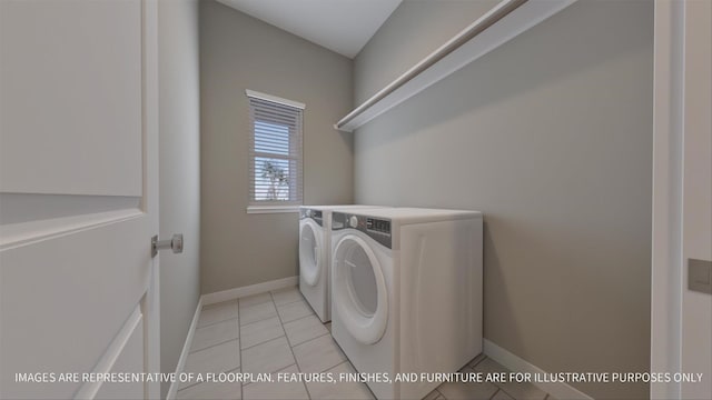 laundry room featuring light tile patterned floors, baseboards, independent washer and dryer, and laundry area