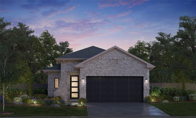 view of front of house with driveway, fence, a shingled roof, a garage, and brick siding