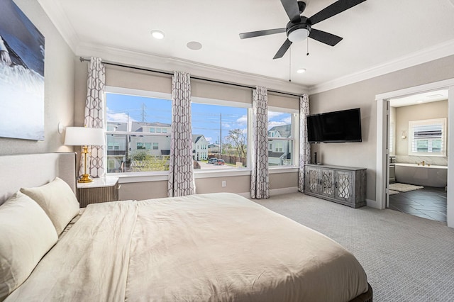 carpeted bedroom with crown molding, connected bathroom, and ceiling fan