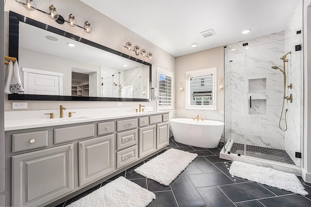 bathroom featuring vanity, separate shower and tub, and tile walls