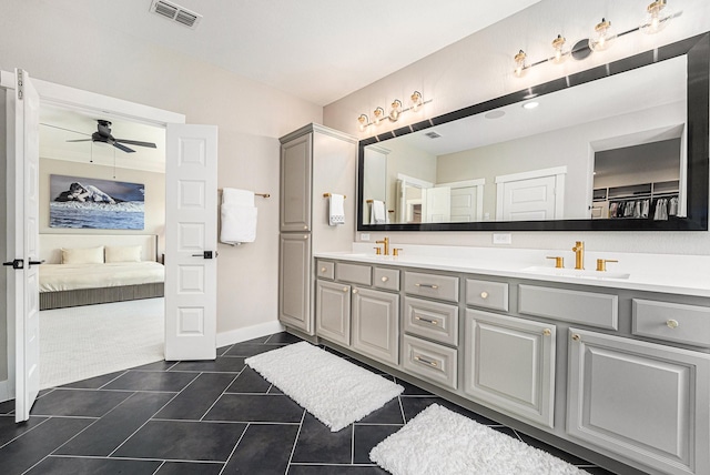 bathroom featuring tile patterned flooring, vanity, and ceiling fan