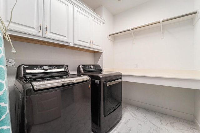 laundry room with cabinets and independent washer and dryer