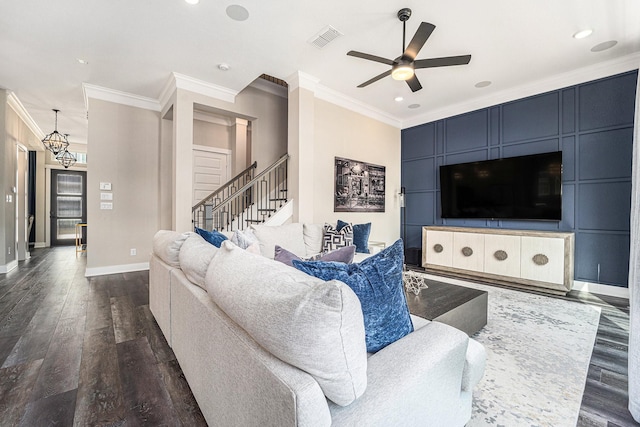 living room with ceiling fan, ornamental molding, and dark hardwood / wood-style floors