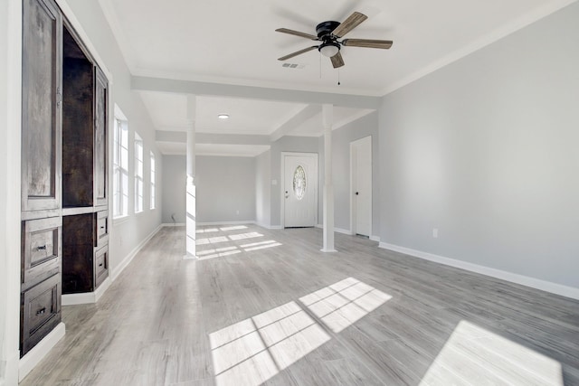 unfurnished living room featuring ceiling fan, beam ceiling, decorative columns, and light hardwood / wood-style flooring