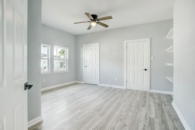 unfurnished bedroom featuring ceiling fan and light hardwood / wood-style flooring