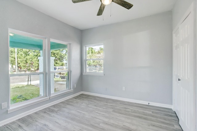 empty room featuring light hardwood / wood-style flooring and ceiling fan