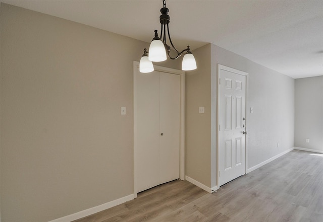 unfurnished dining area with light wood-type flooring