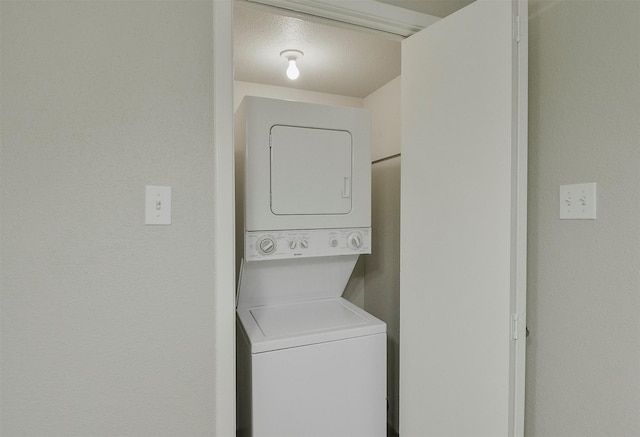 laundry room with stacked washer and clothes dryer