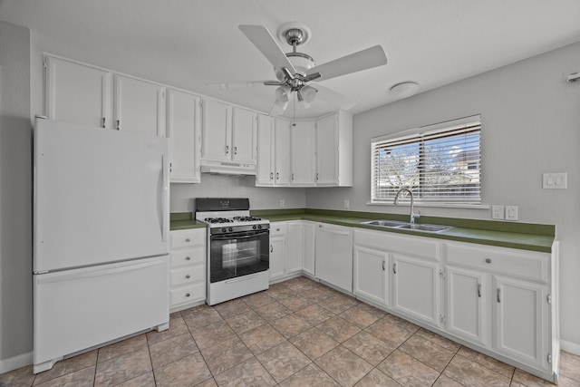 kitchen with white appliances, under cabinet range hood, white cabinets, and a sink