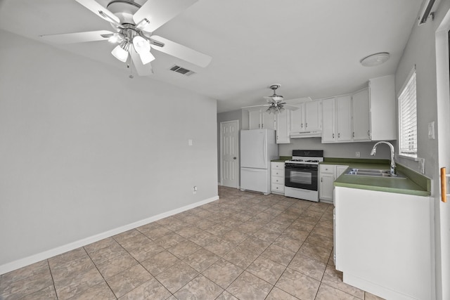 kitchen with white appliances, visible vents, white cabinets, under cabinet range hood, and a sink