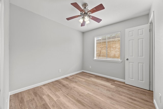 unfurnished bedroom with a ceiling fan, light wood-style flooring, and baseboards