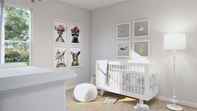 bedroom featuring a nursery area and carpet flooring