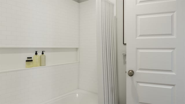 bathroom with a tub to relax in