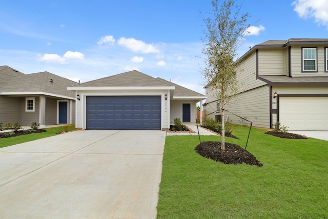 view of front of property with a garage, concrete driveway, and a front lawn