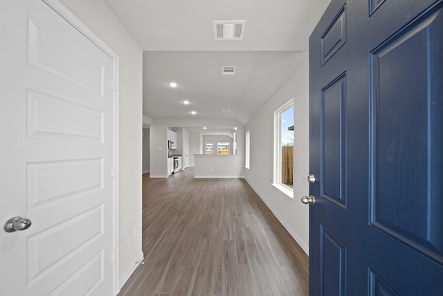 entryway with recessed lighting, dark wood finished floors, visible vents, and baseboards