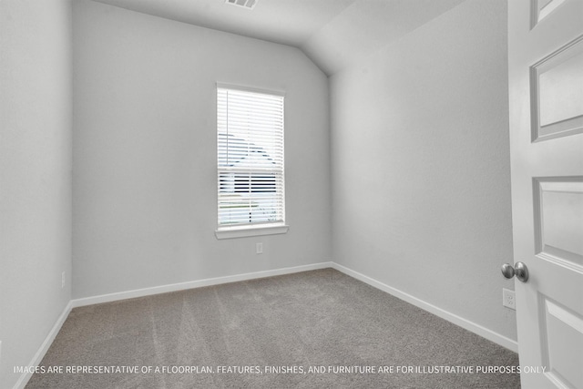 carpeted spare room featuring visible vents and baseboards