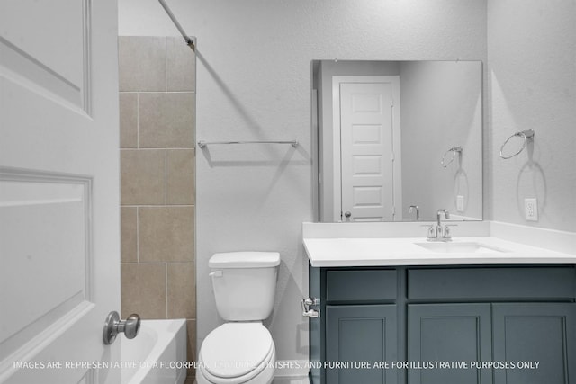 full bathroom featuring shower / bathtub combination, toilet, vanity, and a textured wall