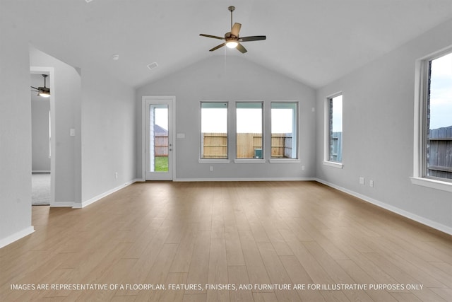 interior space featuring wood finished floors, plenty of natural light, and a ceiling fan