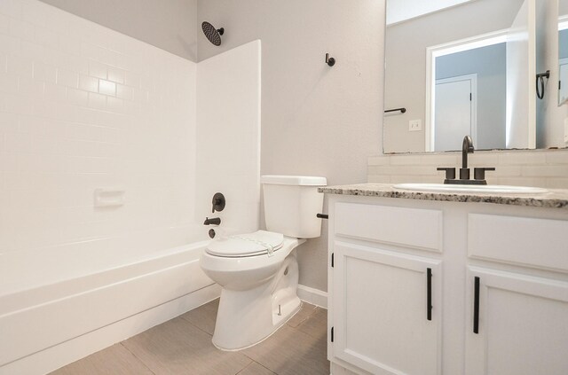 full bathroom with vanity, shower / washtub combination, and toilet