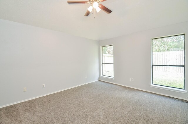 unfurnished room with carpet floors and ceiling fan