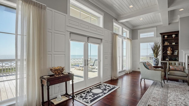 3450 Smiths Pt, Crystal Beach, TX 77650 - foyer with coffered ceiling, a water view, crown molding, dark hardwood / wood-style flooring, and beamed ceiling