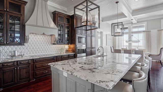3450 Smiths Pt, Crystal Beach, TX 77650 - kitchen with stainless steel appliances, hanging light fixtures, sink, and a large island