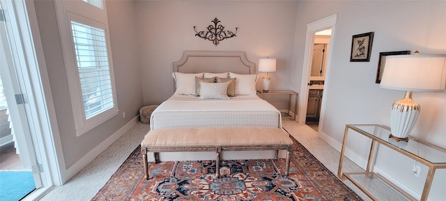 3450 Smiths Pt, Crystal Beach, TX 77650 - bedroom with multiple windows and ensuite bath
