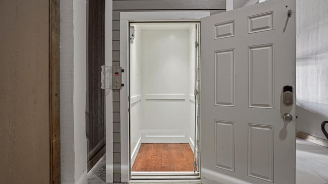 3450 Smiths Pt, Crystal Beach, TX 77650 - entryway featuring elevator and light wood-type flooring