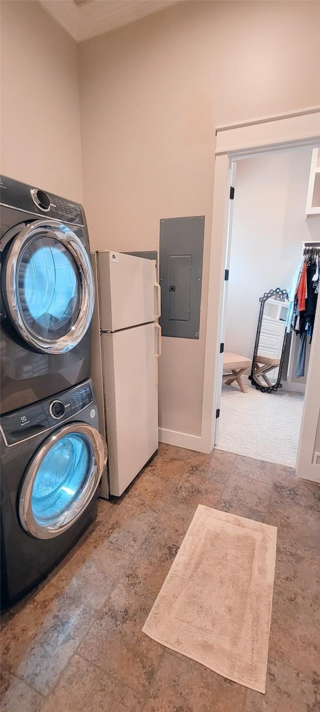 3450 Smiths Pt, Crystal Beach, TX 77650 - washroom featuring stacked washer / drying machine and electric panel